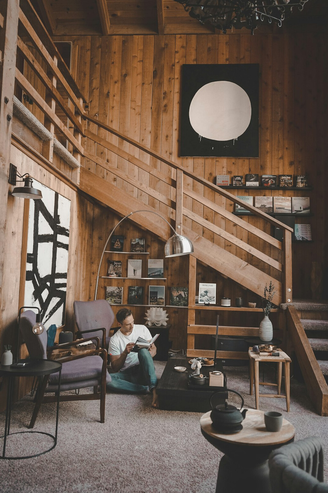 person reading book in quiet room