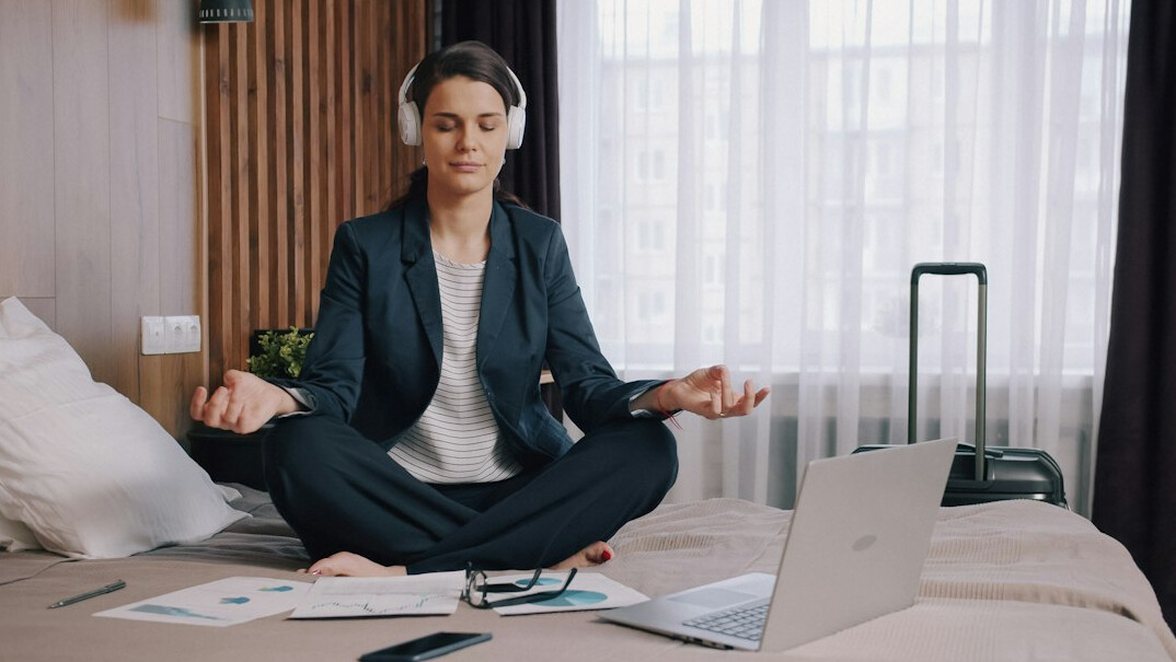 person meditating before meeting