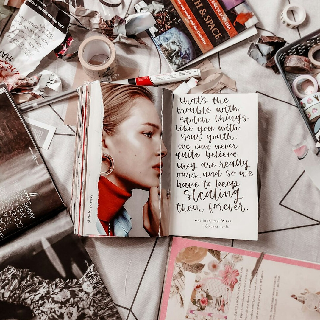 Open journal with handwriting on a table